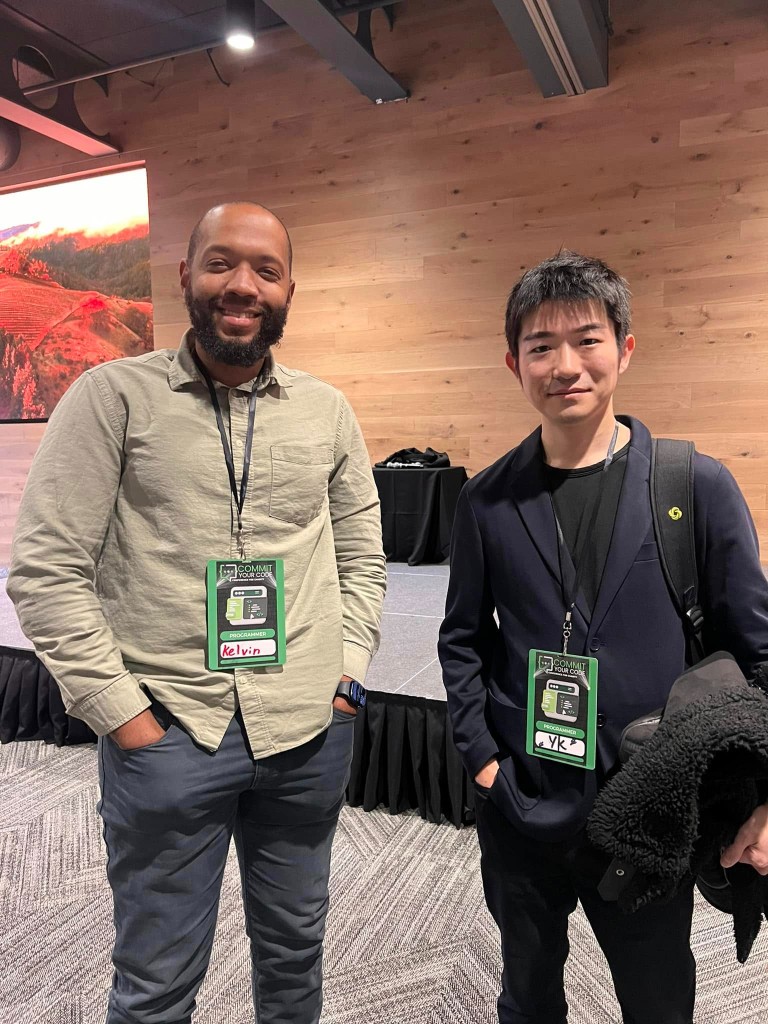 Kelvin at Commit Your Code with programmer badge